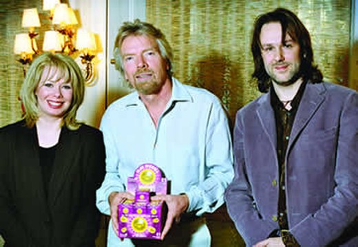 Matthew and Elaine Sweetapple presenting Peeball to Richard Branson